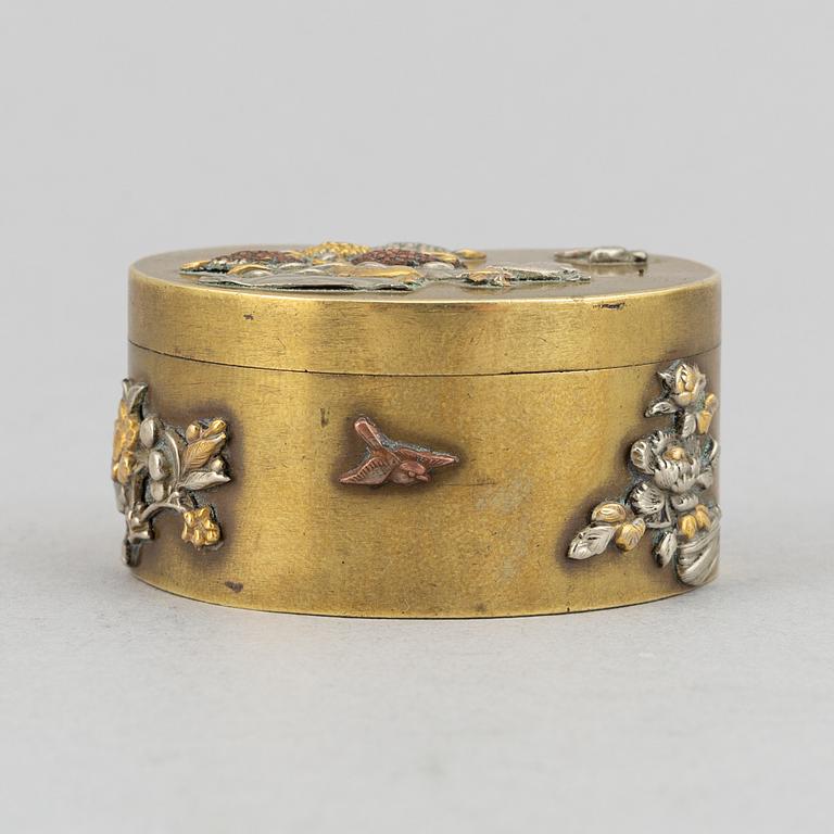 A lidded heart shaped brass box with cover, Meiji period (1868-1912), around the year 1900.