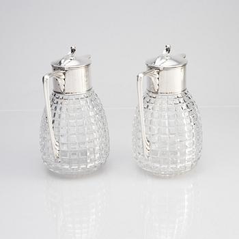 A pair of parcel-gilt silver and "hobnail" crystal decanters, W.A. Bolin, Stockholm 1920.