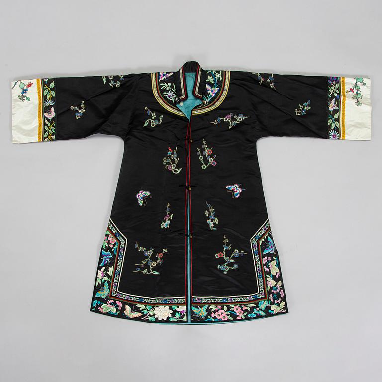 A Chinese embroidered silk robe and a buzi and five other silk embroideries, early 20th century.