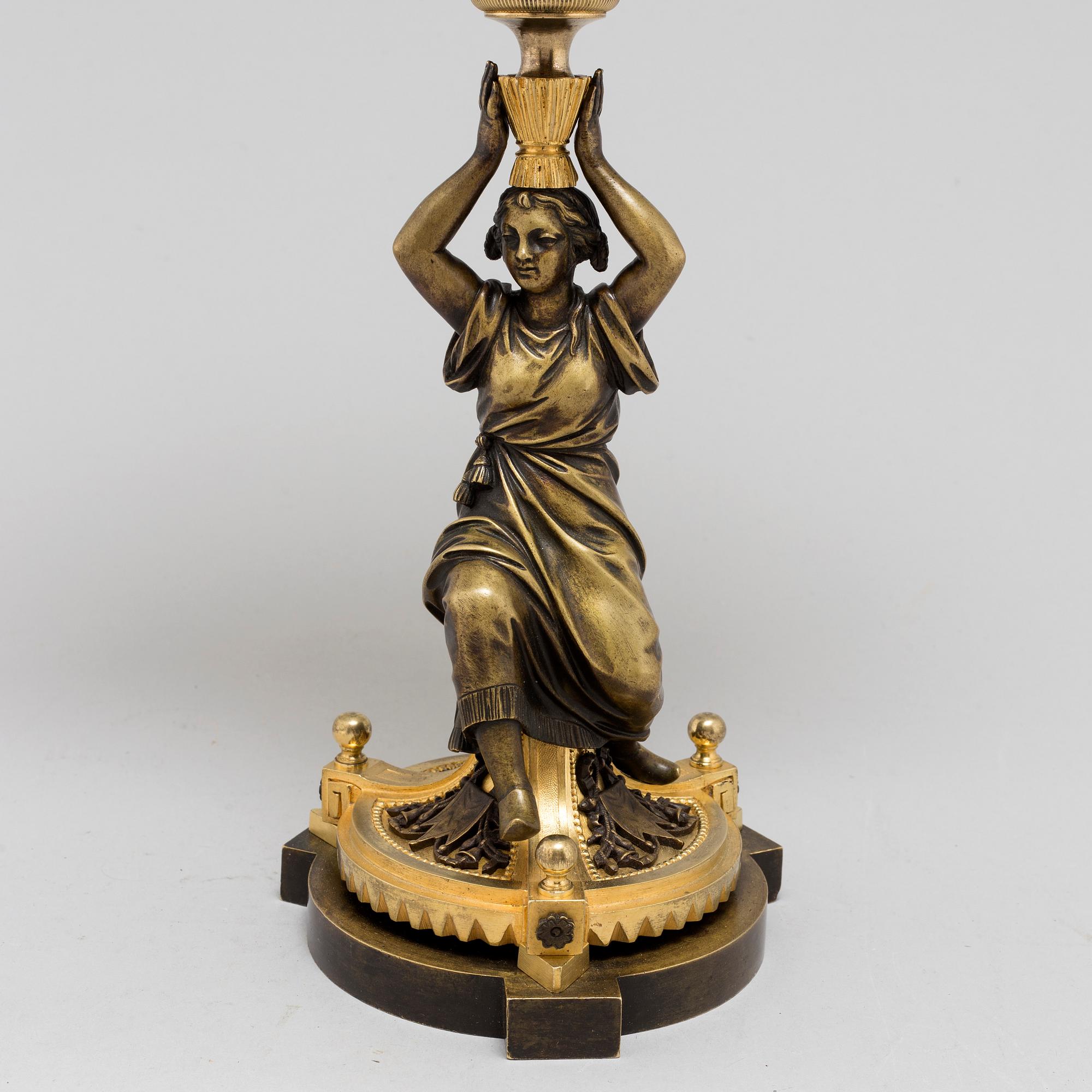 AN EMPIRE ORMOLU TABLE MIRROR, first half of the 19th century.