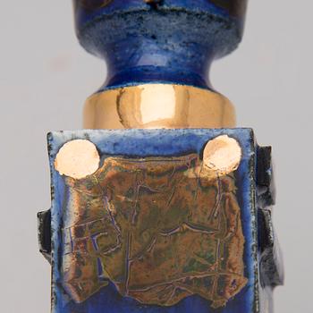 A pair of ceramic candlesticks signed Kaipiainen.