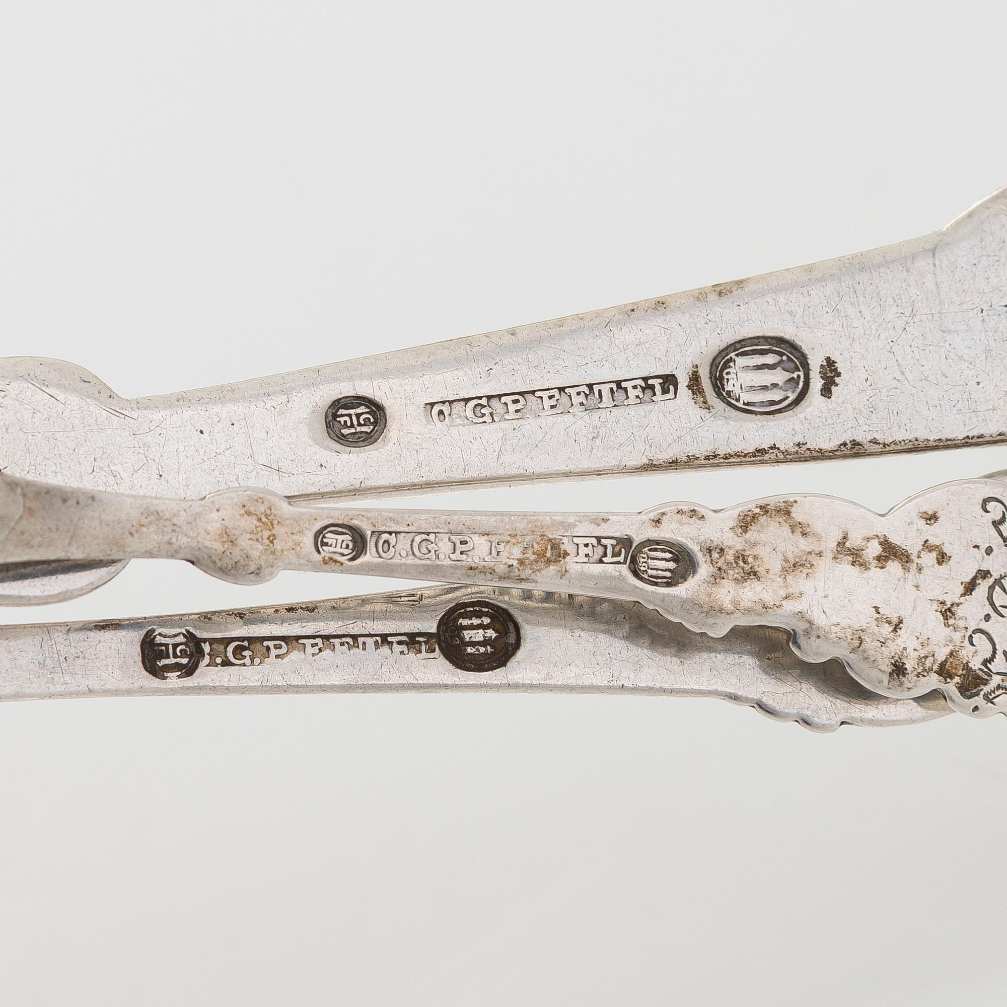 A set of  four silver serving spoons, with a set of 12 coffee spoons, Denmark, early and first half of the 20th century.