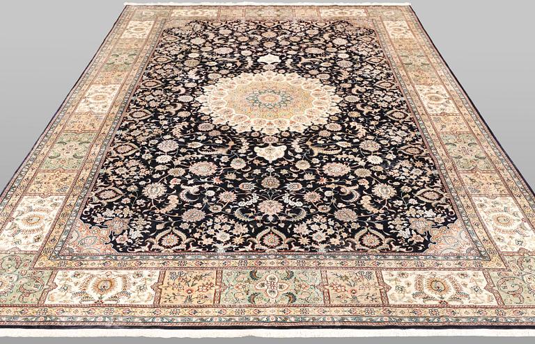 An Oriental silk carpet, approx. 283 x 184 cm.