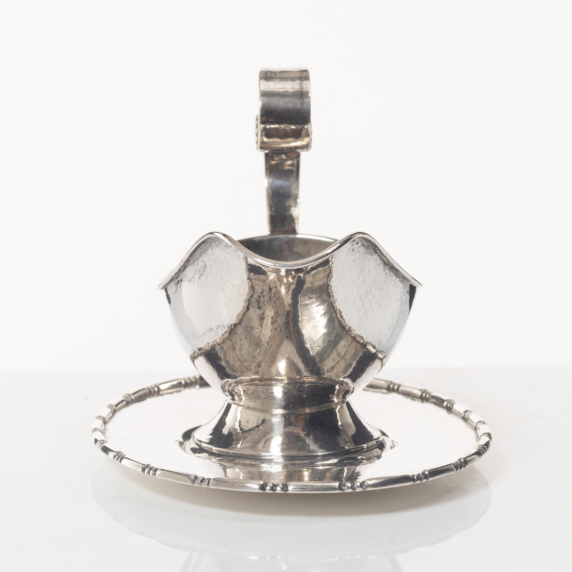 A Swedish silver sauce boat, marks of C.G. Hallberg, Stockholm 1926.