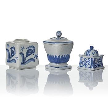 Wilhelm Kåge, eleven pieces of faience including jars, inkwells and a tulip vase, Gustavsberg, Sweden, 1919-1920.