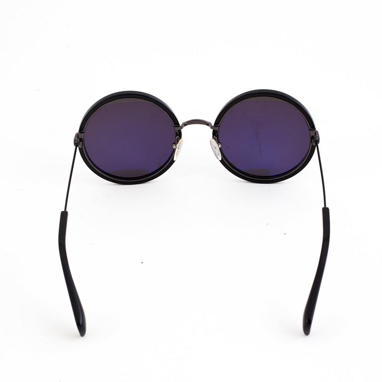 A pair of Yohji Yamamoto sunglasses.