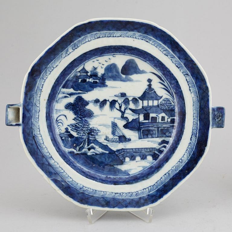 A set of three blue and white plates and a hot water dish, Qing dynasty, 18th/19th Century.