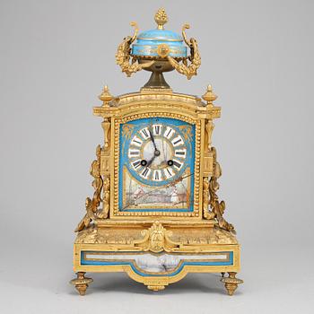 A late 19th Century bronze and porelain mantel clock.