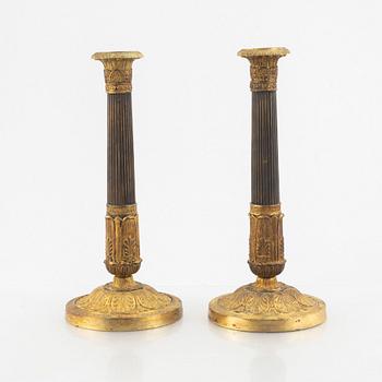 A pair of Empire candle sticks, 19th century.