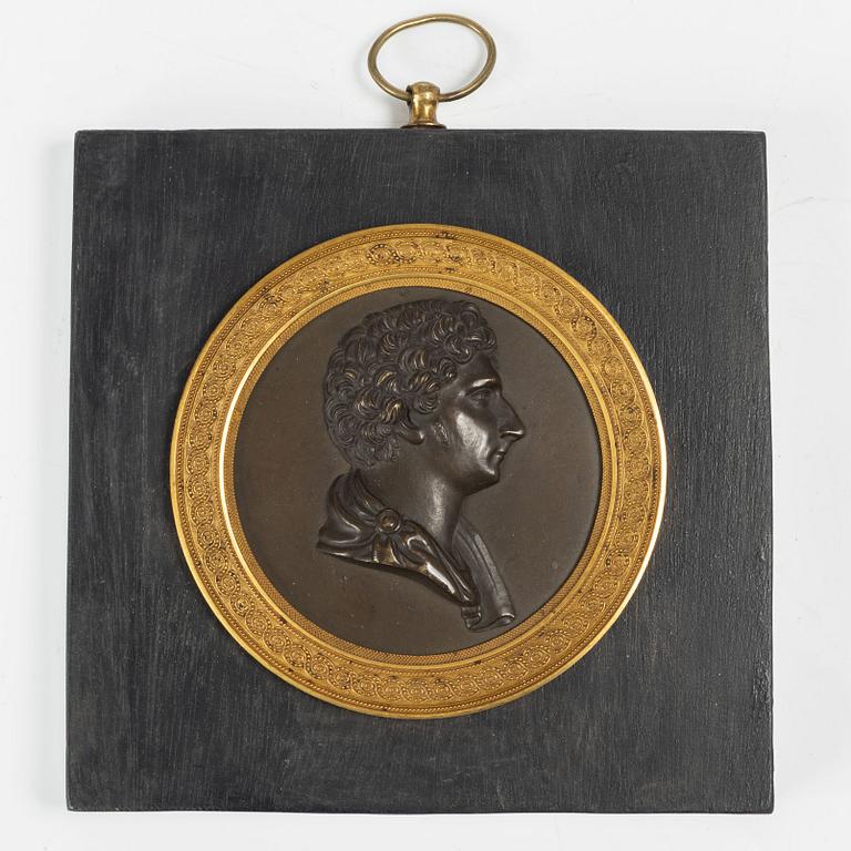 A Swedish Empire ormolu and patinated bronze portrait medallion depicting Karl XIV Johan, early 19th Century.