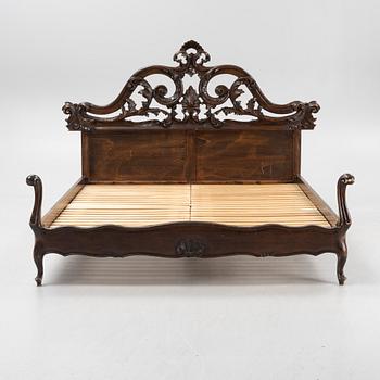 A rococo style bed frame, around 1900.