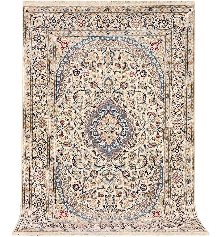 A Nain carpet, part silk, 9 laa, c. 300 x 195 cm.