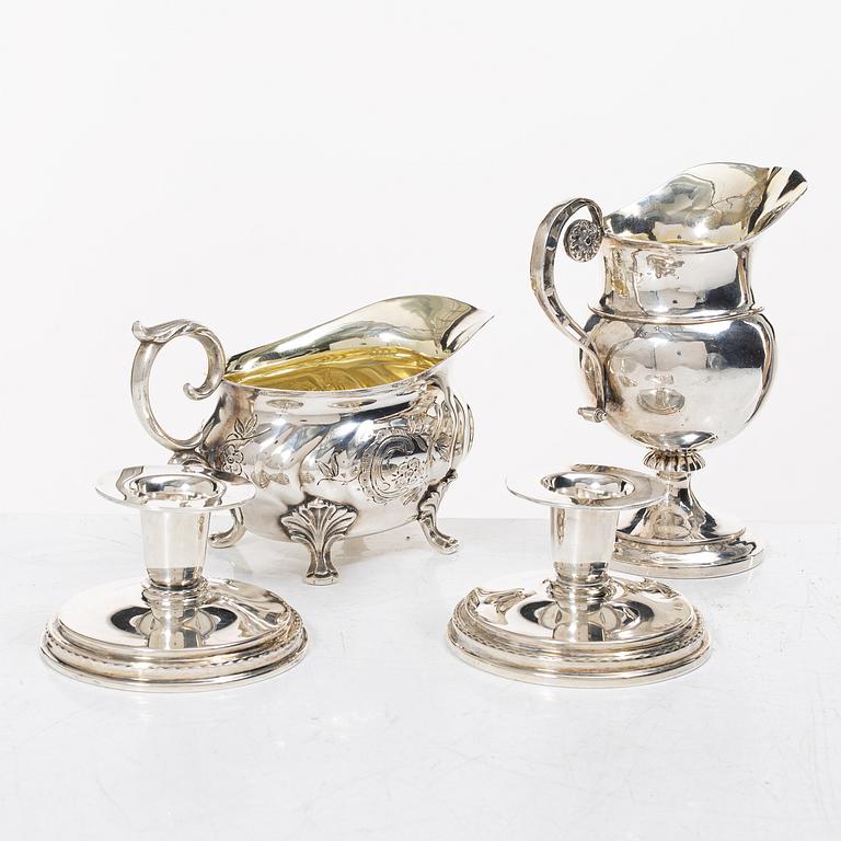 Two jugs and a pair of candlesticks, CG Hallberg among others.