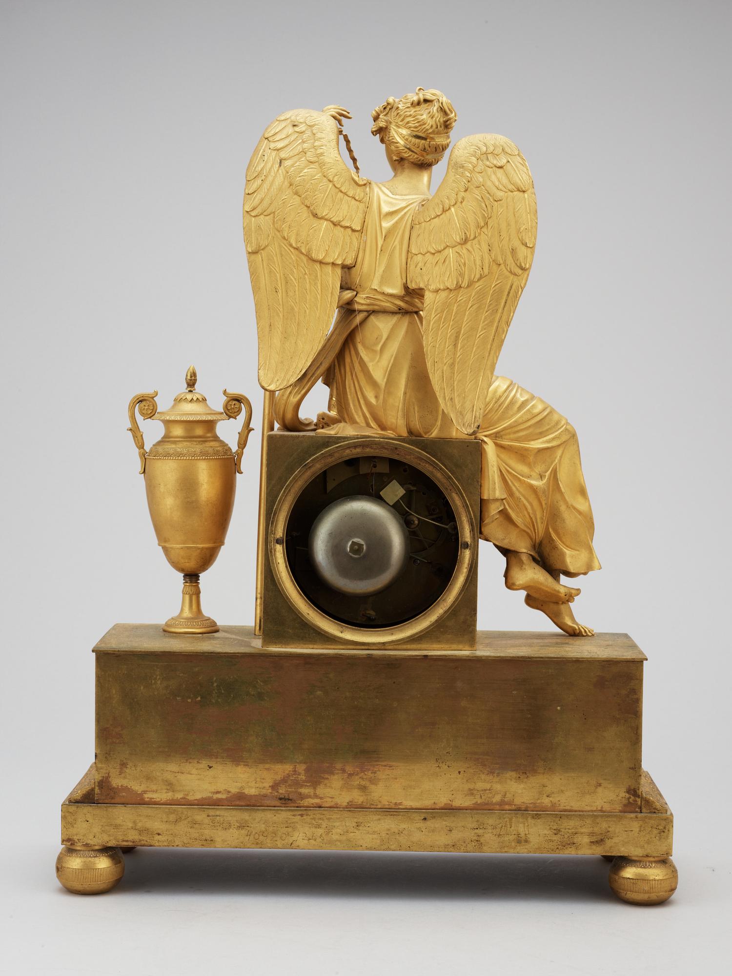 A French Empire early 19th century gilt bronze mantel clock.