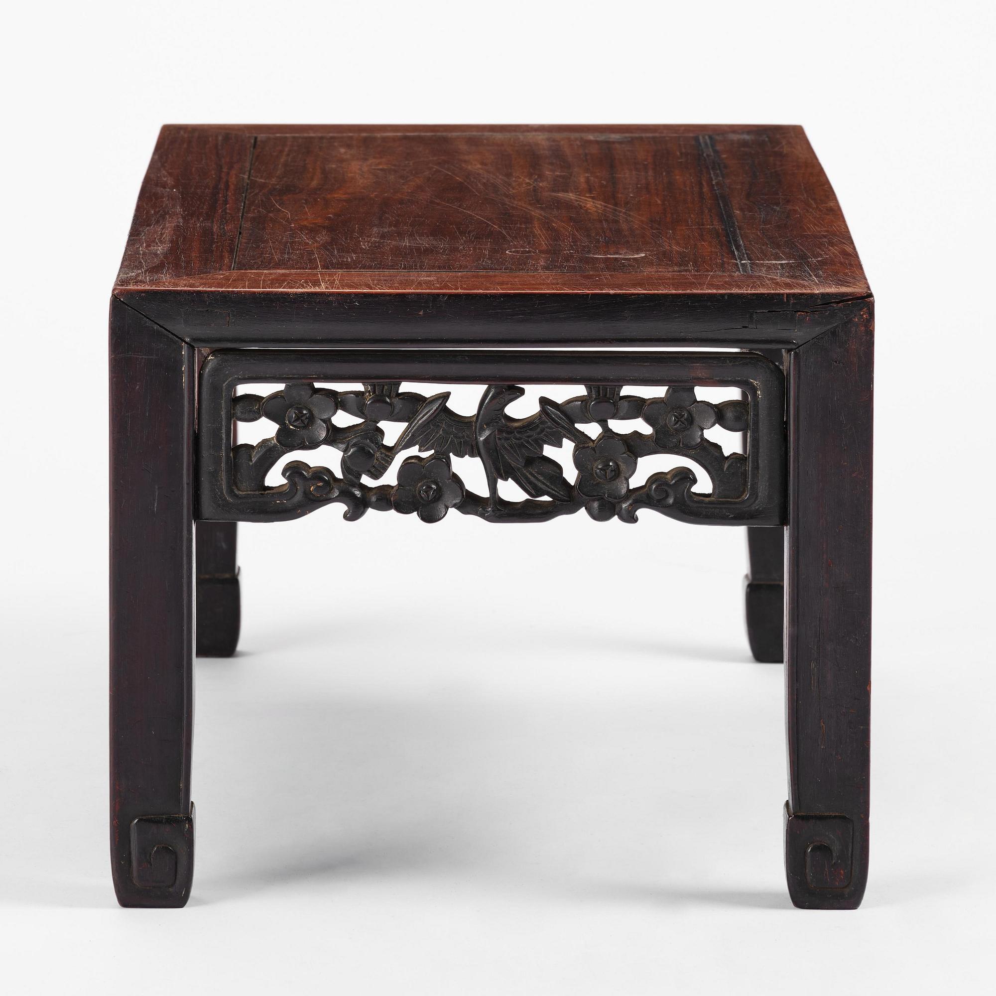 A Chinese hardwood kang table, late Qing dynasty.