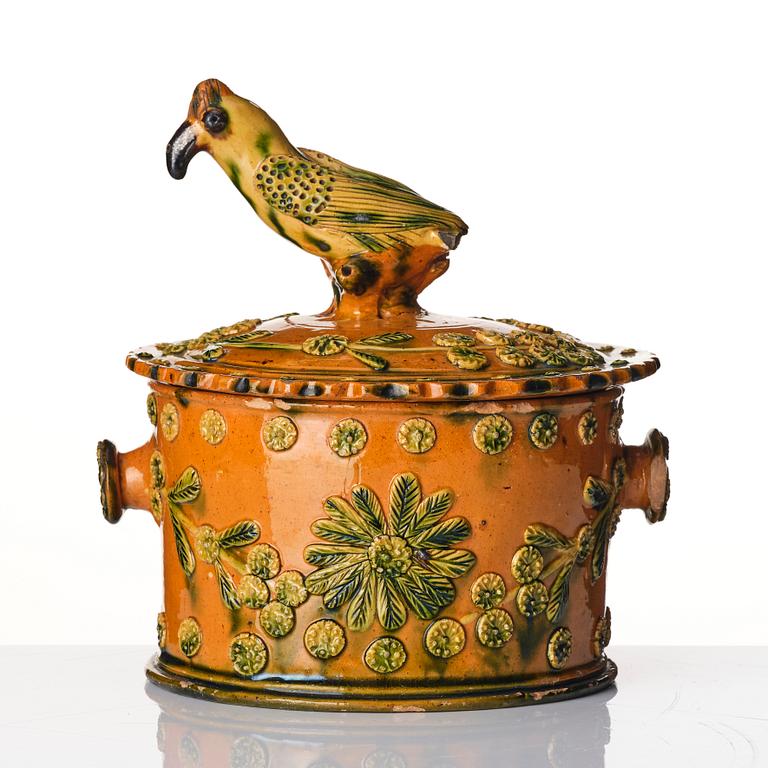 A glazed earthenware jar with cover, probably France, 19th century.