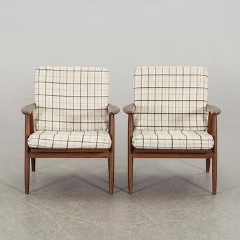 A pair of second half of the 20th century armchairs.