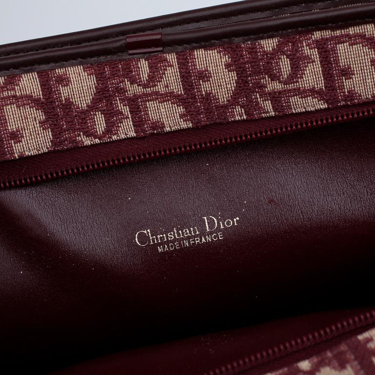 CHRISTIAN DIOR, a red monogram canvas handbag.