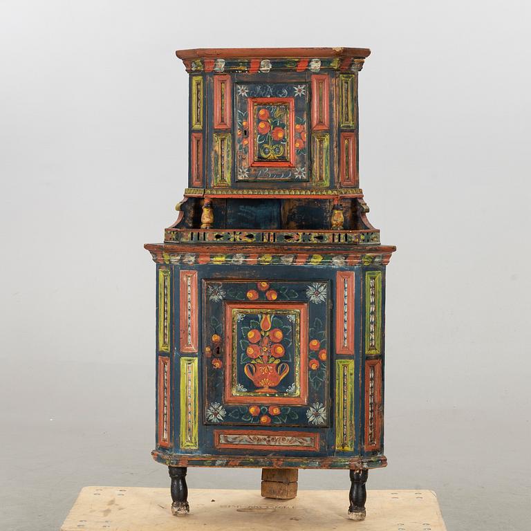 A SWEDISH CORNER CABINET, 1855.