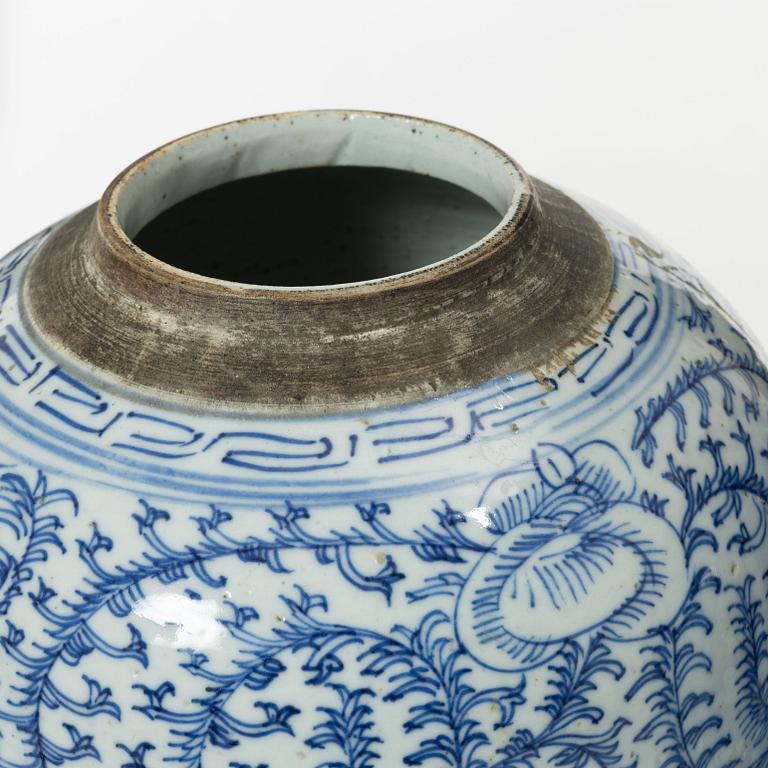 Two similar Chinese blue and white porcealin jars with wooden covers, Qing dynasty, 19th Century.