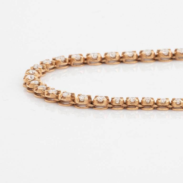 18K rose gold and brilliant cut diamond necklace.