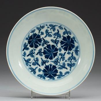 A set of four blue and white lotus dishes, Qing dyanasty with Qianlong sealmark.