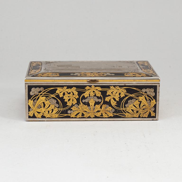 A steel and brass cigarr box by Emil Olsson Eskilstuna around 1900.