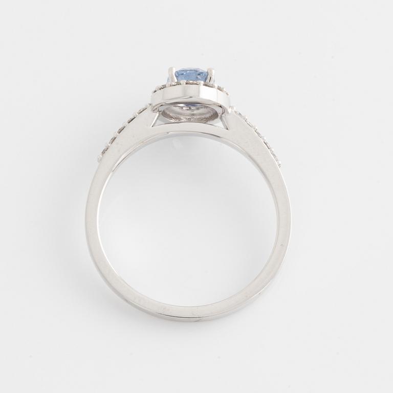 Ring with oval sapphire and brilliant-cut diamonds.