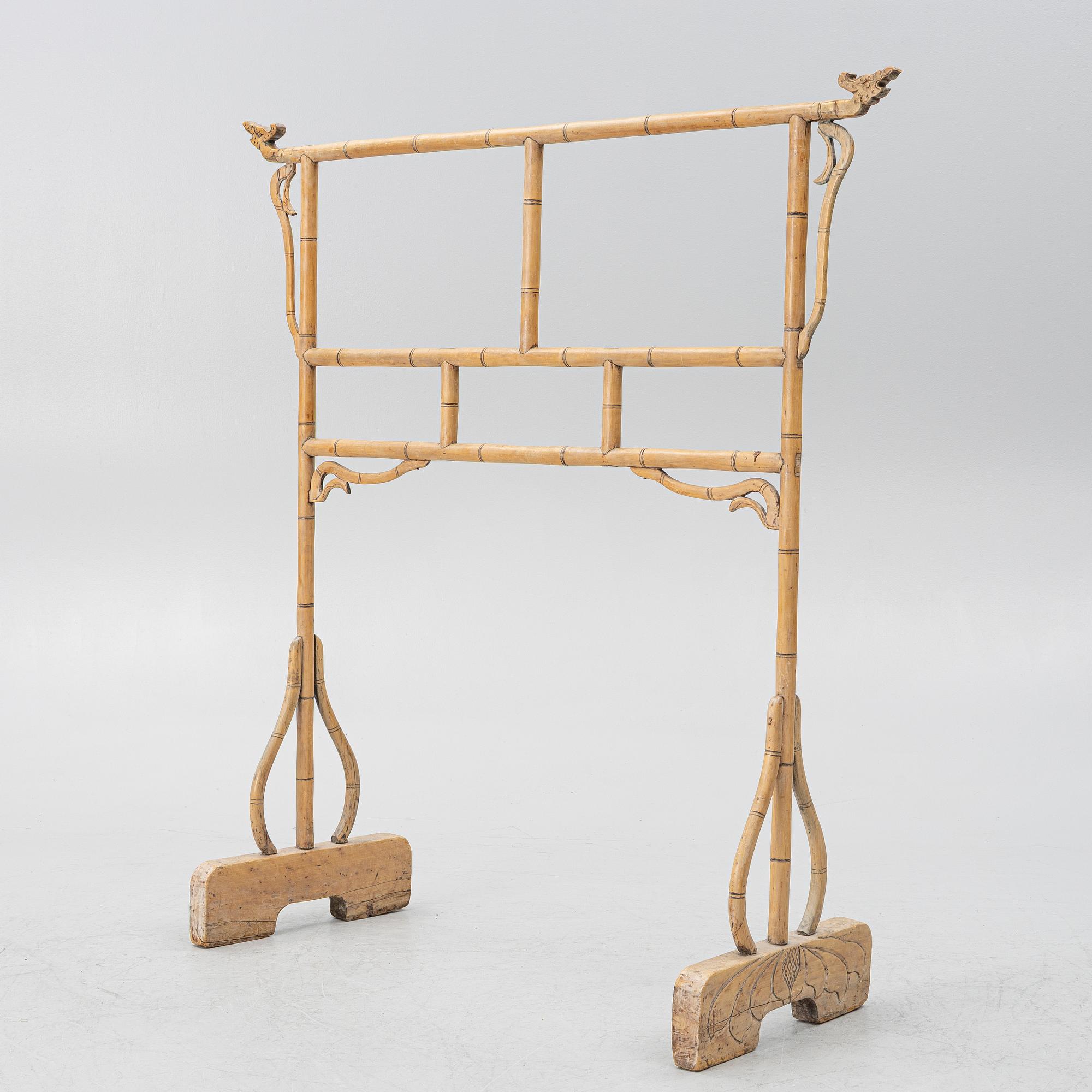 A Chinese bamboo and hardwood clothes rack, 20th century.