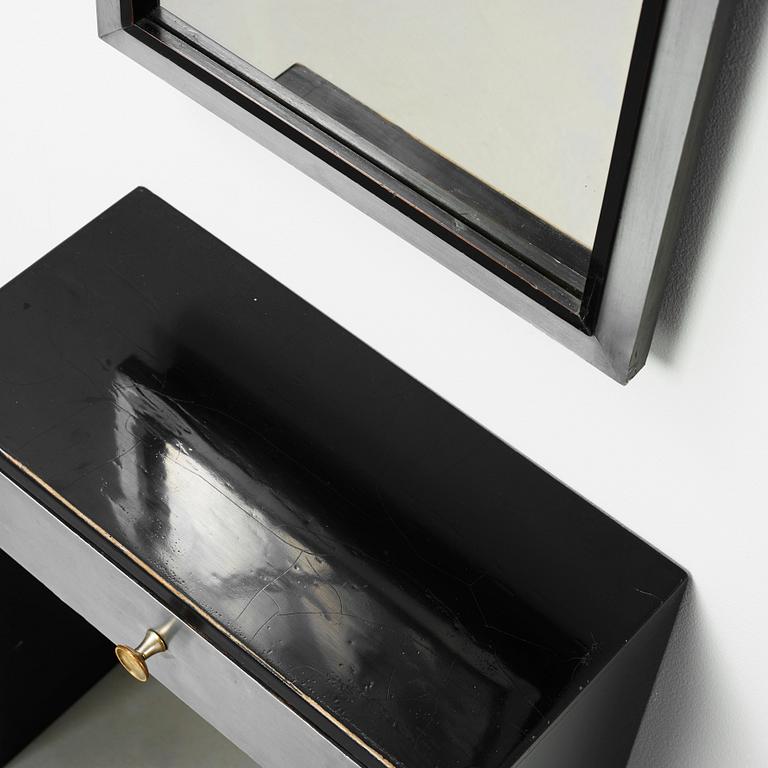 A Swedish modernist  black lacquered and pewter wall mirror and table, 1930's.