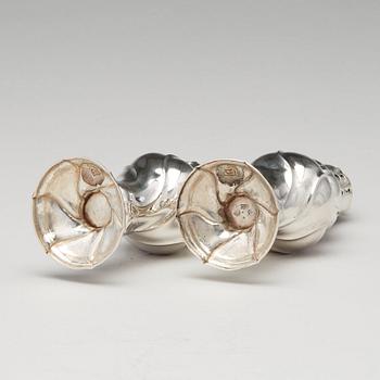 A matched pair of Swedish Rokoko silver sugar-casters, one marked Olof Gravander, Kristinehamn 1764, one a later copie.