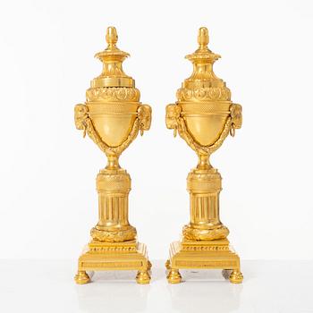 A pair of French Louis XVI style gilt-bronze casolettes, later part 18th century.