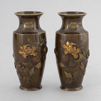 A pair of Japanese patinated bronze and mixed metal vases, Meiji period (1868-1912).