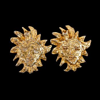 A set of two earclips by Yves Saint Laurent.