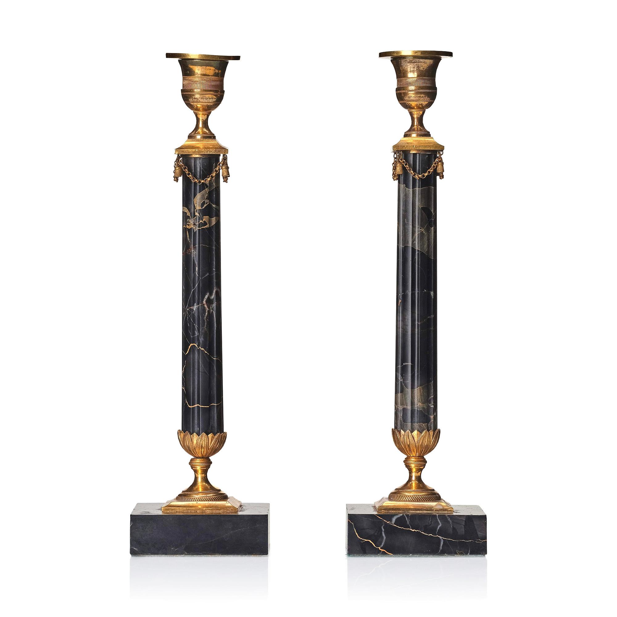 A pair of late Gustavian Portor marble candlesticks, late 18th century.