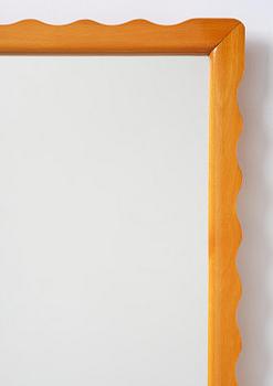 Swedish Modern, a wall mirror with wave-shaped frame, 1940s.
