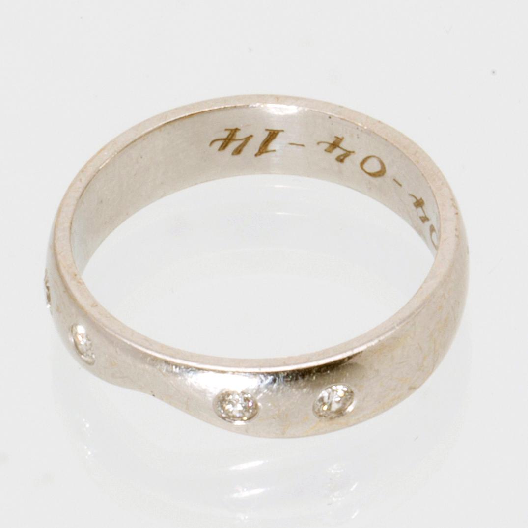 Ring 18k whitegold 4 brilliant-cut diamonds approx 0,15 ct, size 56,5.