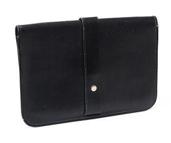 A black 1970s/80s leather clutch by Christian Dior.