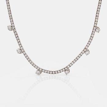 A Cartier necklace in platinum and 18K gold set with round brilliant-cut diamonds.