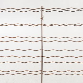 A 20th century metal wine rack.