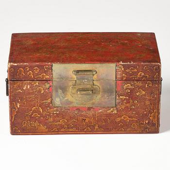 A set of two gilt decorated leather clad wooden chests, late Qing dynasty.