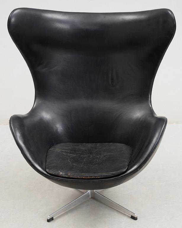 An Arne Jacobsen black leather 'Egg' chair, Fritz Hansen, Denmark 1960's.