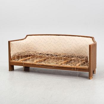 Otto Wretling, attributed to, an Art Nouveau pine sofa, Sweden early 20thC.