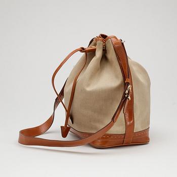 CÉLINE, a leather and canvas shoulder bag.