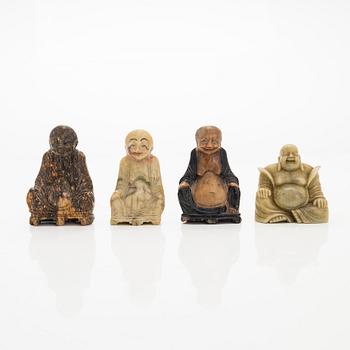 A set of four soapstone sculptures of Buddai, China, 20th century.