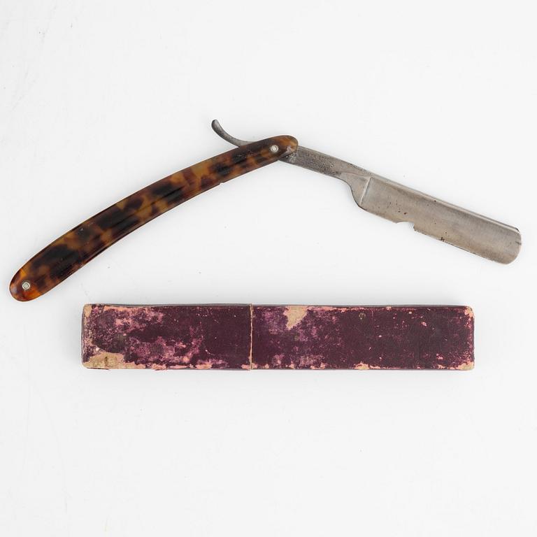 An early 19th century mahogny-veneered box for shaving utensils.
