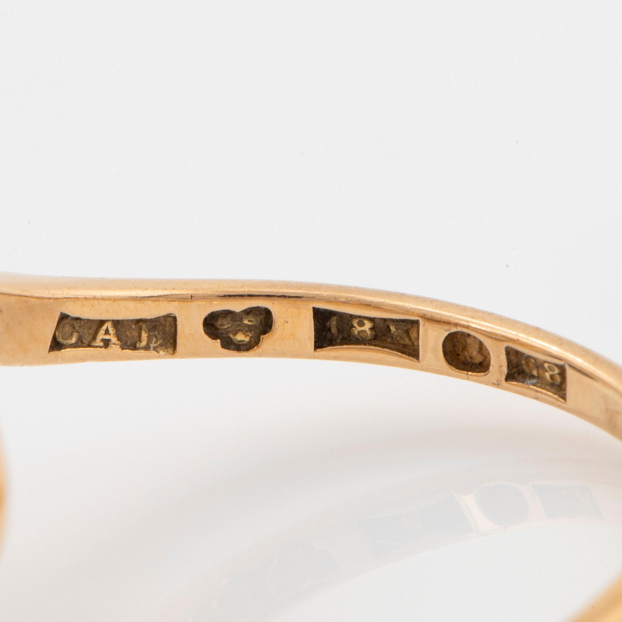 An 18K gold ring set with two old-cut diamonds with a total weight of ca 3.10 cts quality ca J/K si.