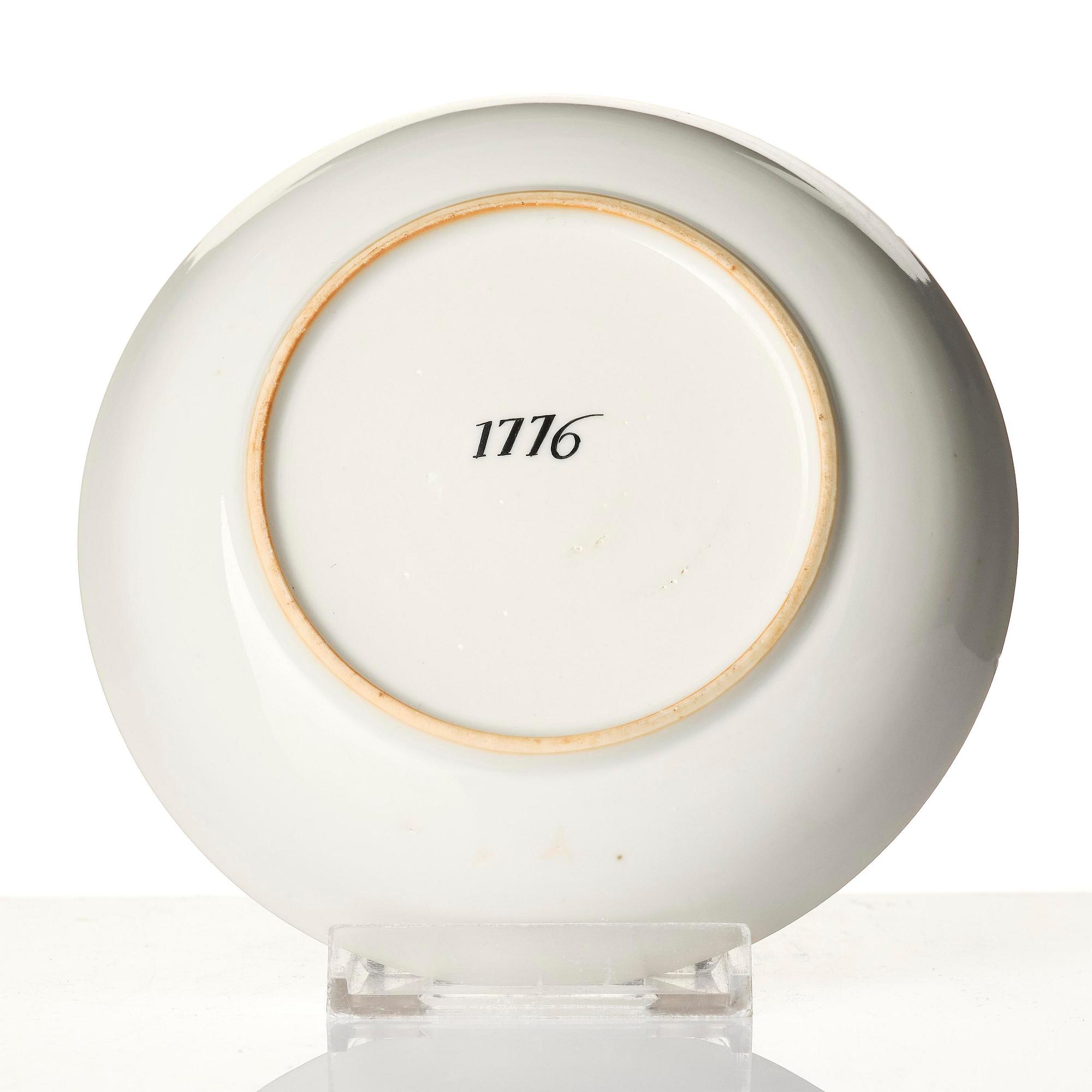 A famille rose armorial cup and stand with the monogram of the Swedish King Gustavus III, Qing dynasty, 18th century.