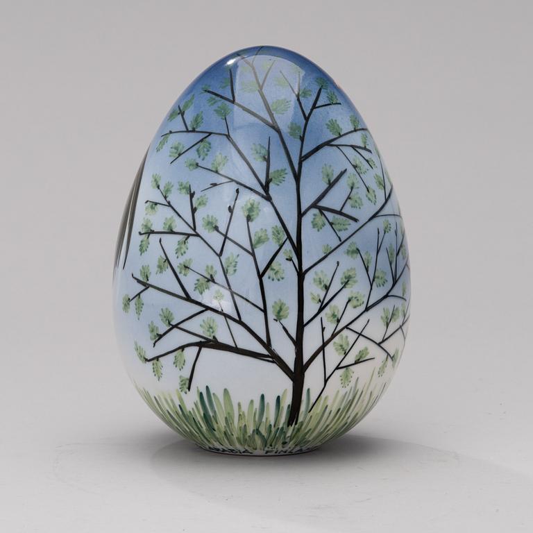 A porcelain egg signed GOG Arabia Finland.