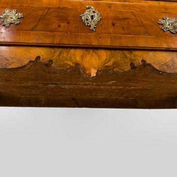 A Swedish walnut-veneered rococo cabinet in the manner of C. Linning, latter half of the 18th Century.